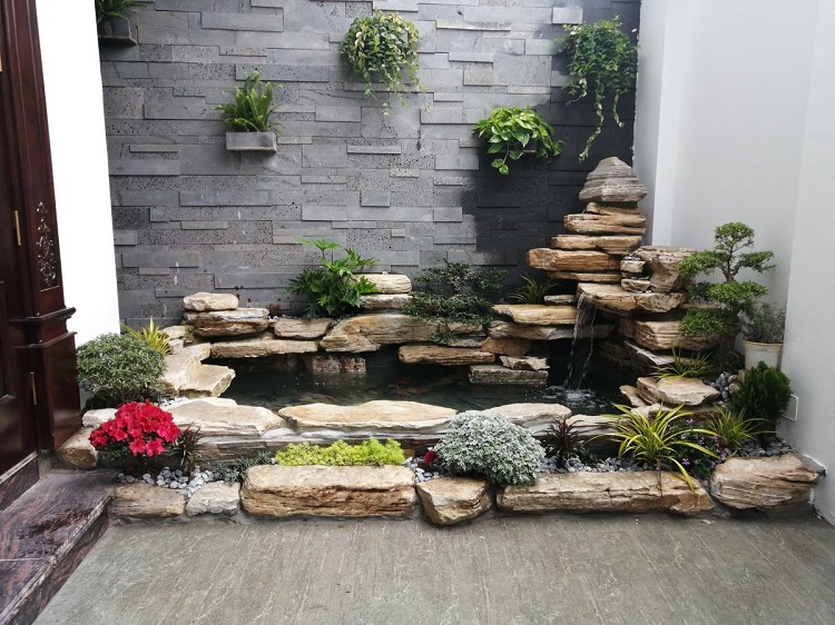 Kolam ikan dalam rumah dengan air terjun batu, Sumber: id.pinterest.com